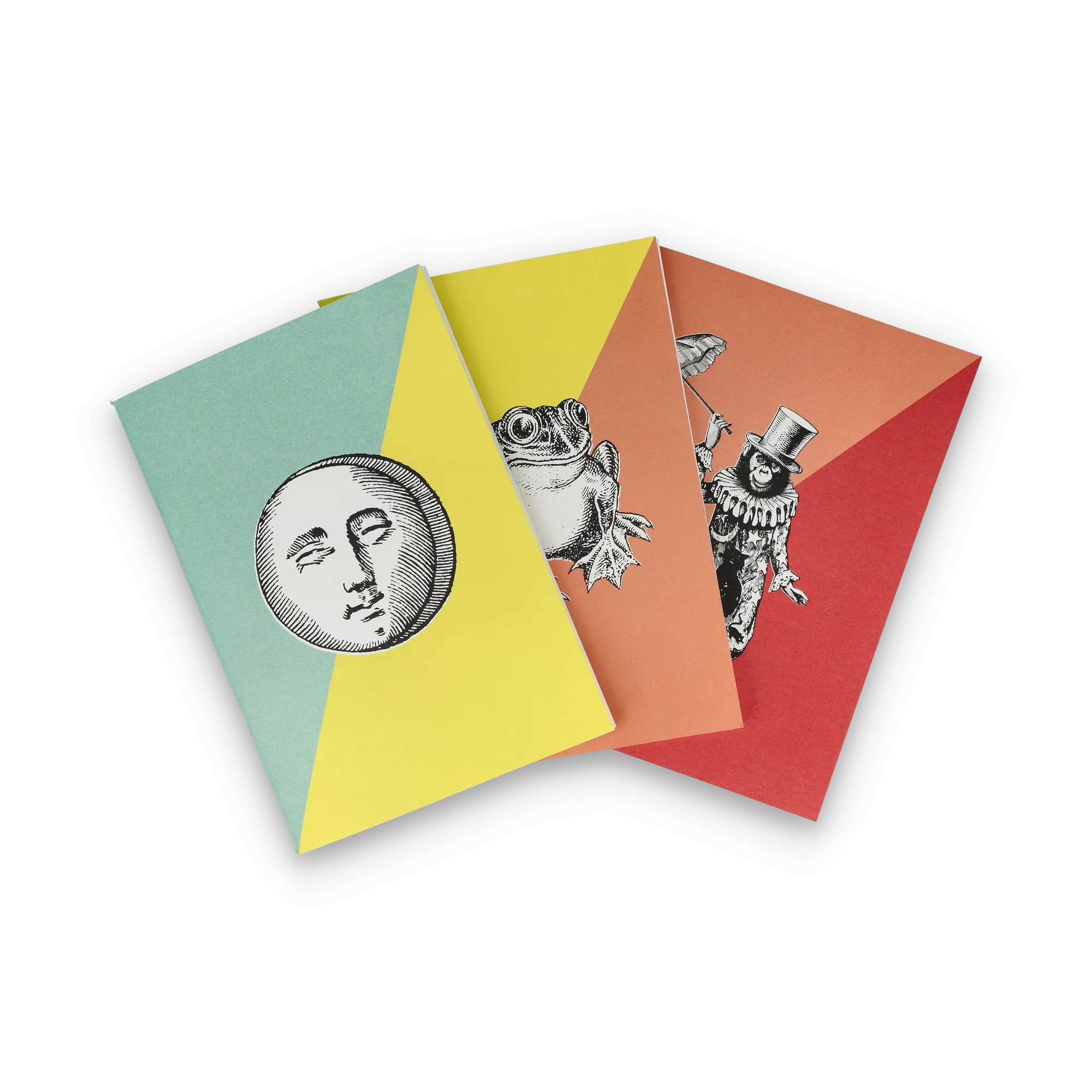 Drei Notizbücher mit diagonalen Farbbereichen und Vintage-Illustrationen von Mond, Frosch und Clown.