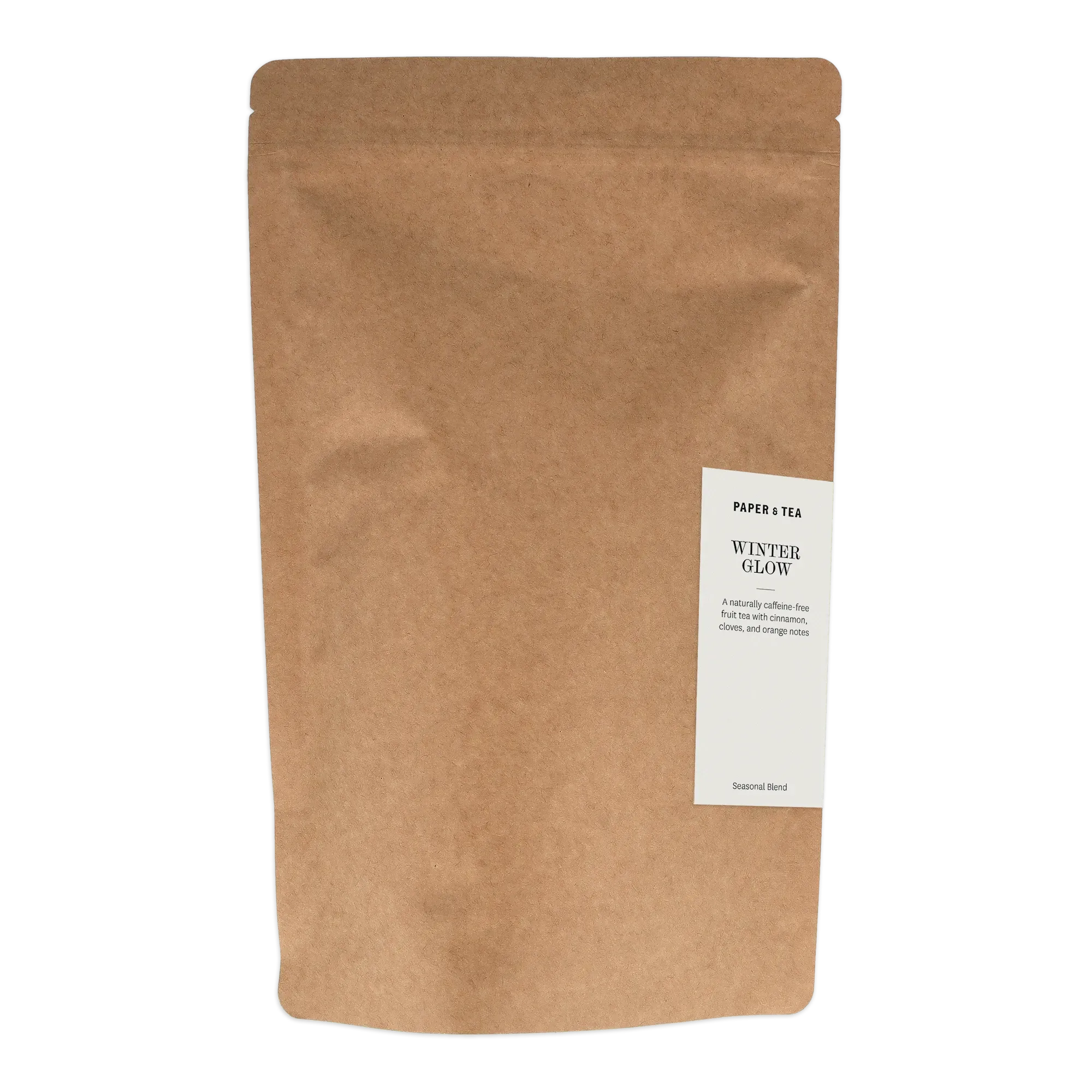 Braune Verpackung mit weißem Etikett von PAPER & TEA Winter Glow, koffeinfreier Früchtetee